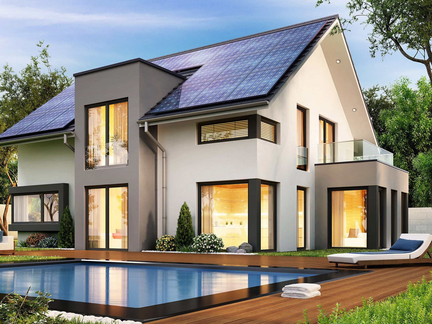 Rückansicht eines Hauses. Im Vordergrund ist ein Pool.